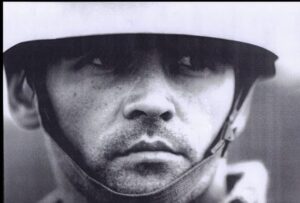 Black-and-white close-up in a helmet